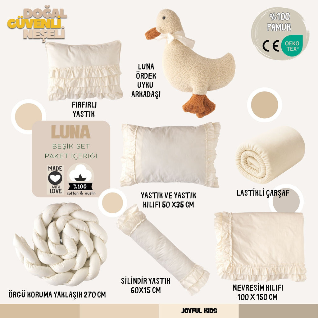 Krem rengi zarif bebek odası için 8 parçadan oluşan tam uyku seti görünümü.