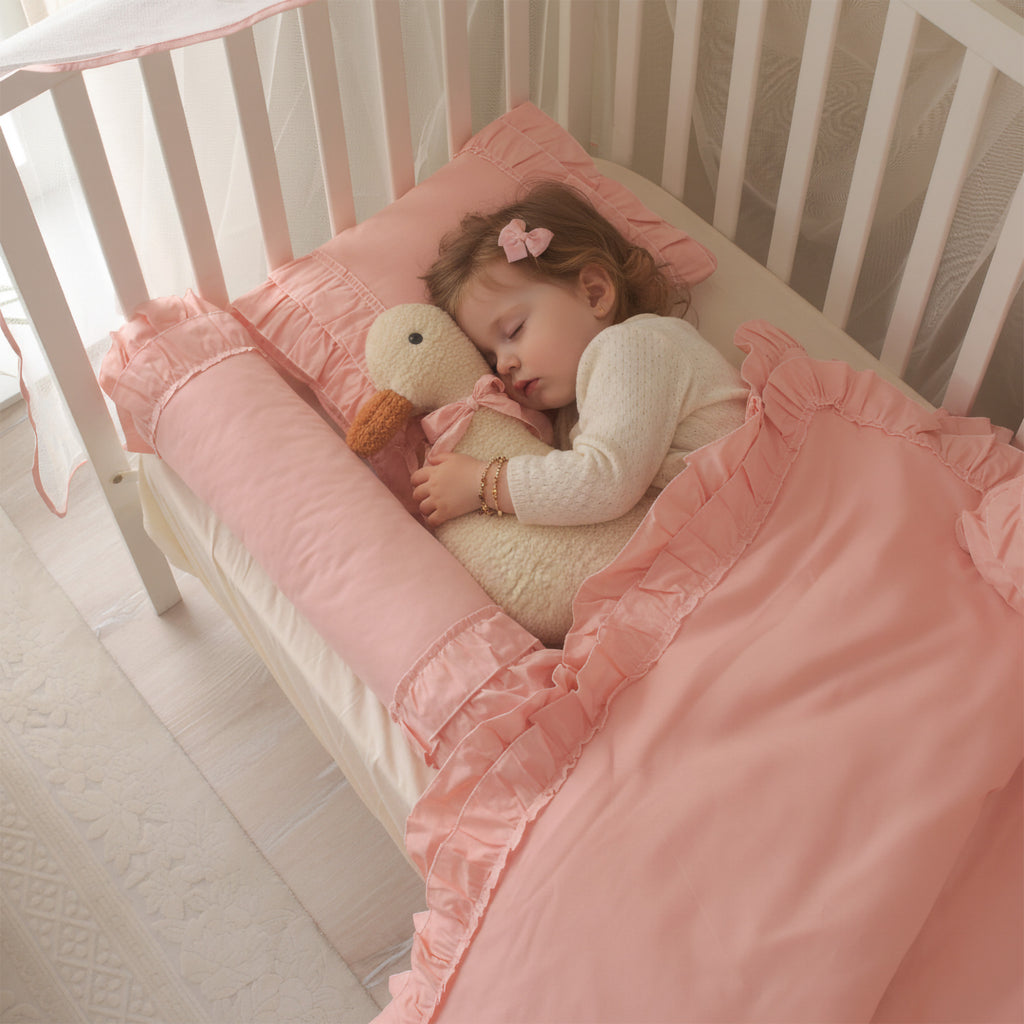 Pembe %100 pamuk kumaşın nefes alan, yumuşak ve antialerjenik yüzey detayı.