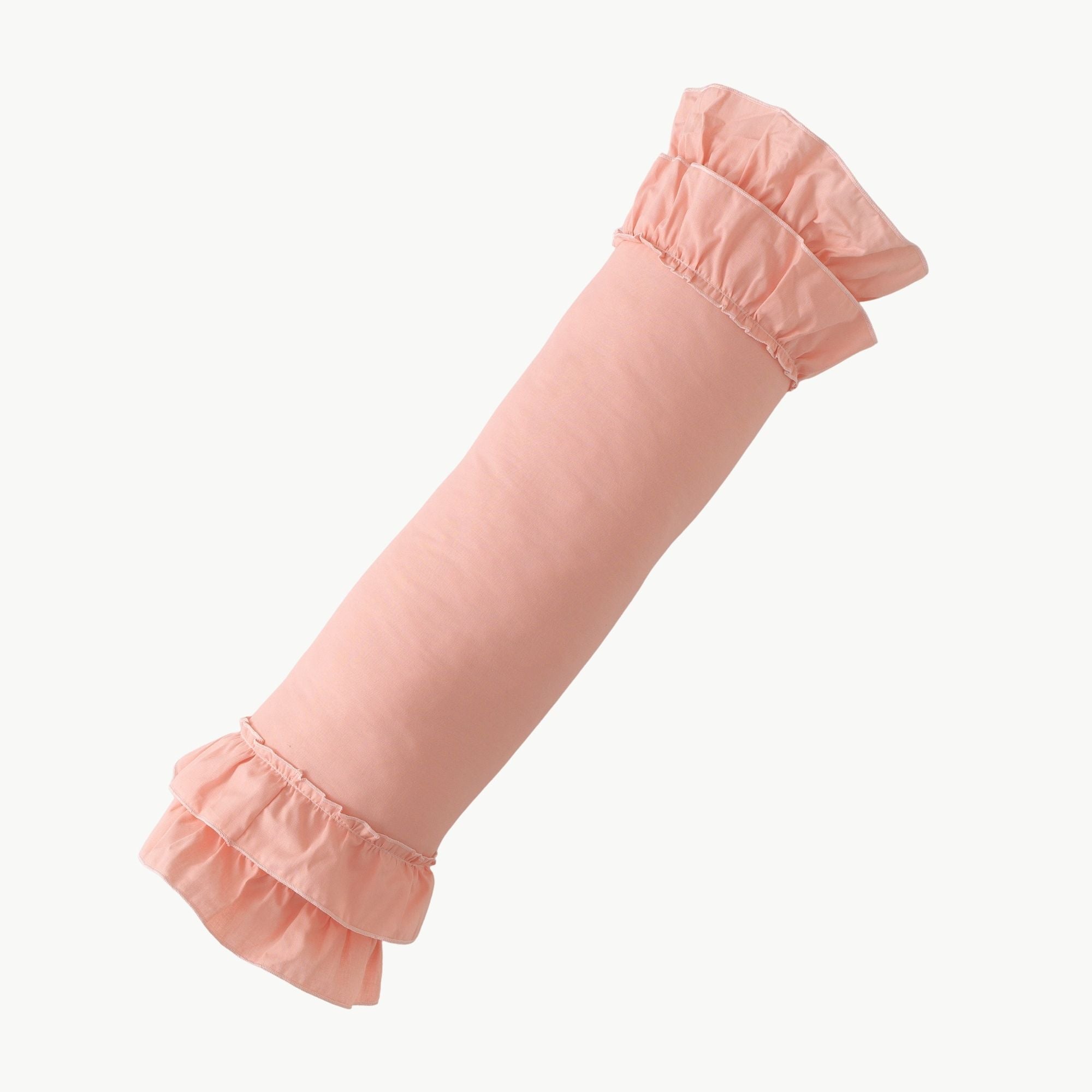 Pembe renkli fırfır detaylı silindir bebek yatağı kenar koruma yastığı.